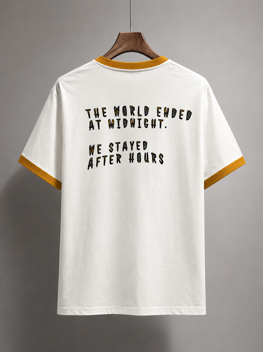 White t-shirt with black text on a gray background