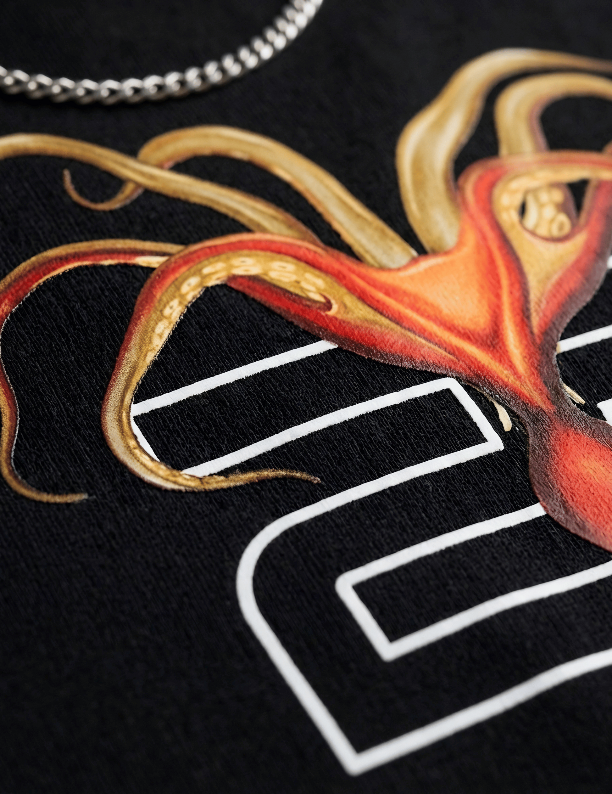 Close-up of a black shirt with an octopus design.