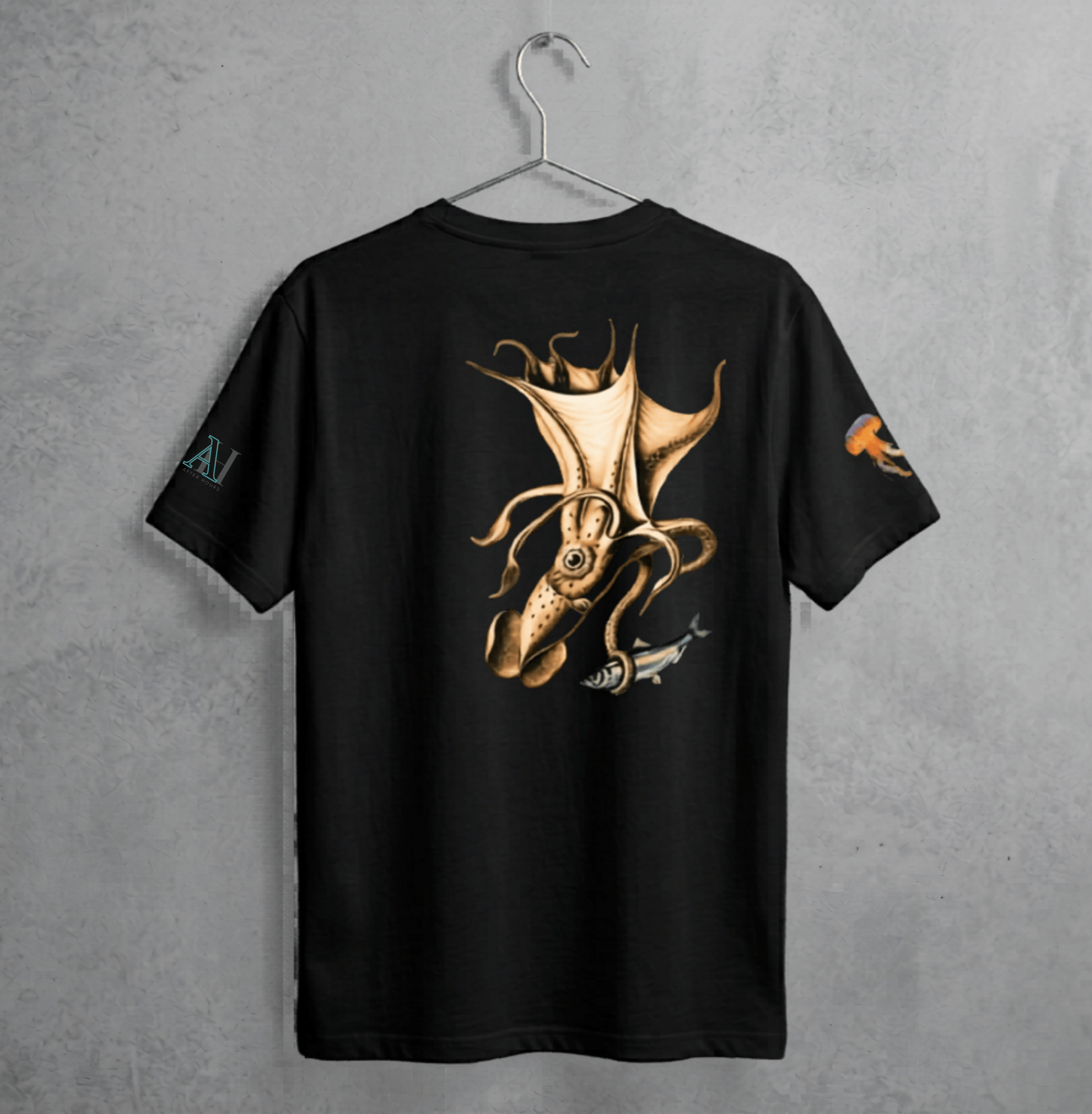 Black t-shirt with gold squid design on a grey textured background