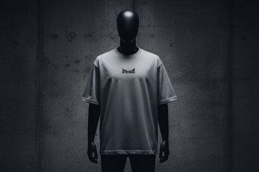 Grey t-shirt with a small black logo embroidered on a grey background