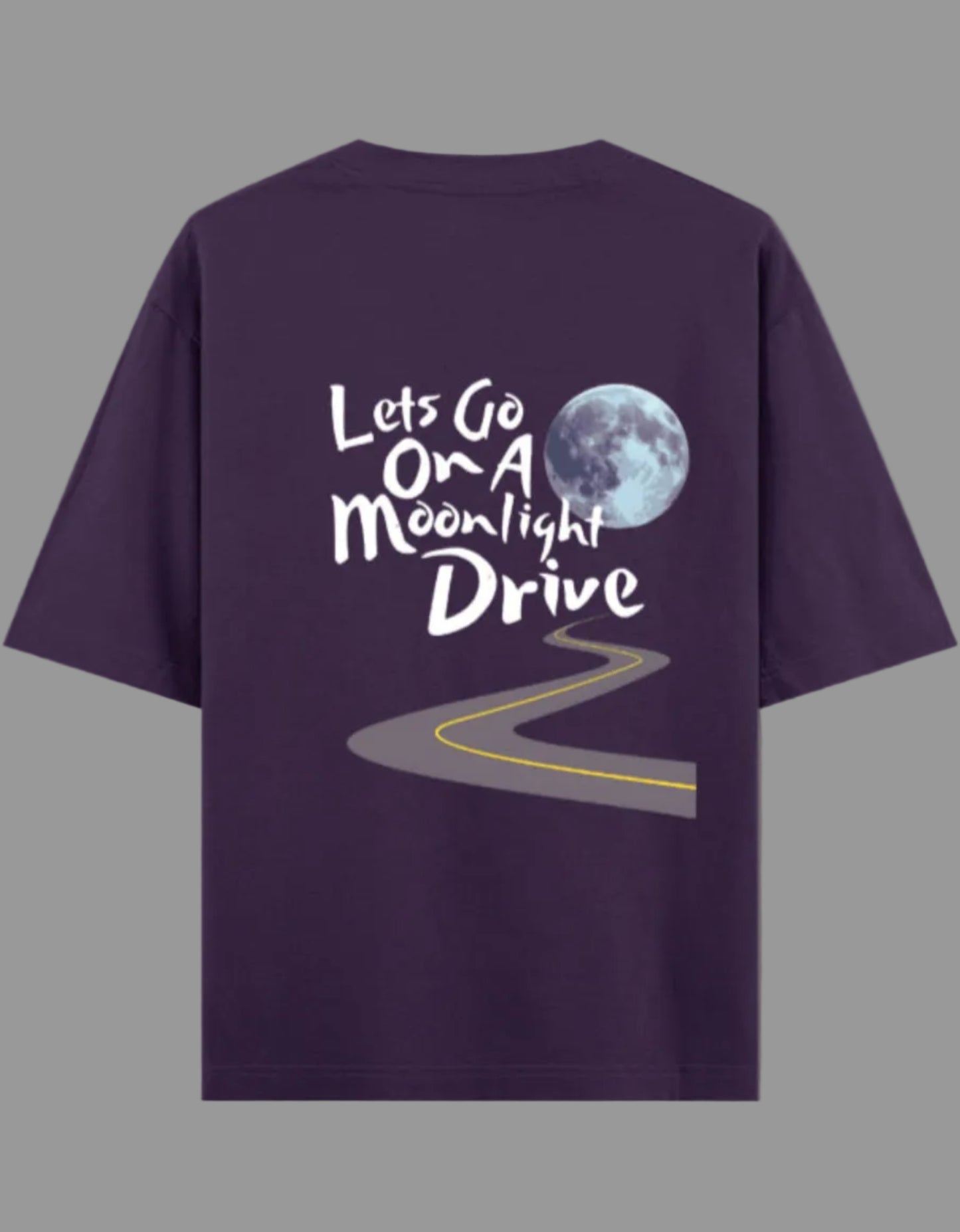 Purple t-shirt with a moonlit drive graphic and text on a gray background