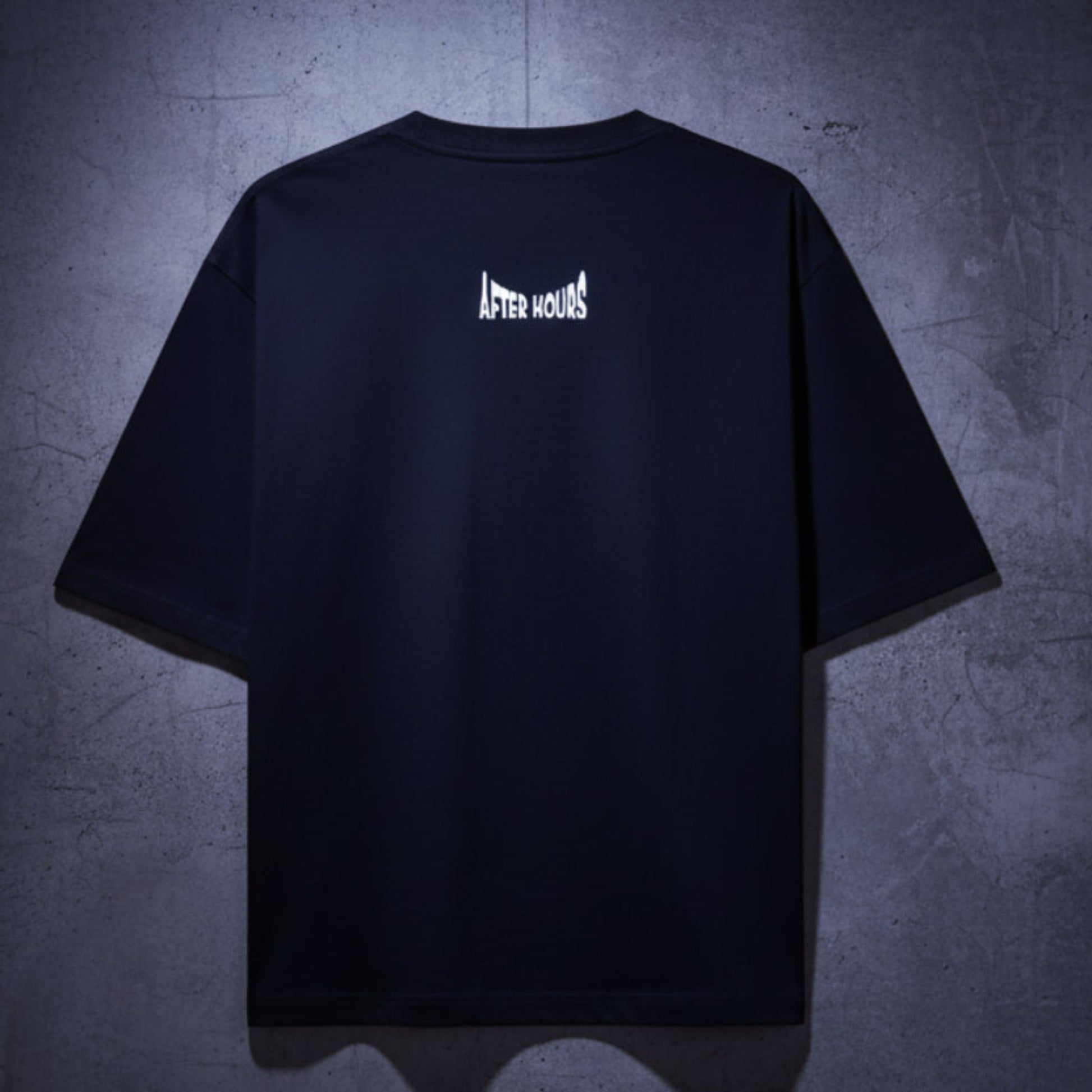 Black t-shirt with "After Hours" embroidered on the back against a grey background