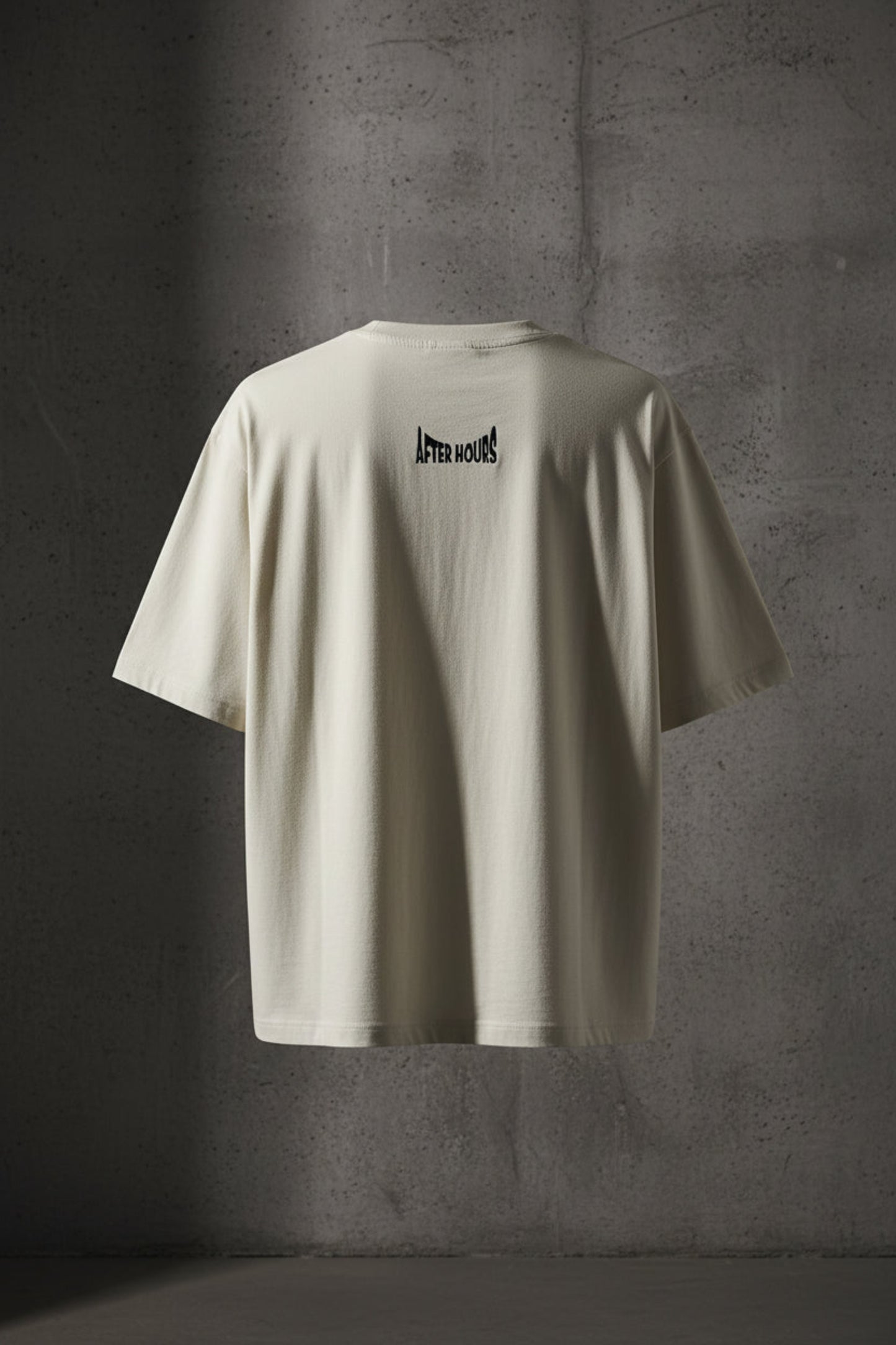 Off-white t-shirt with black text embroidered on the back against a grey background