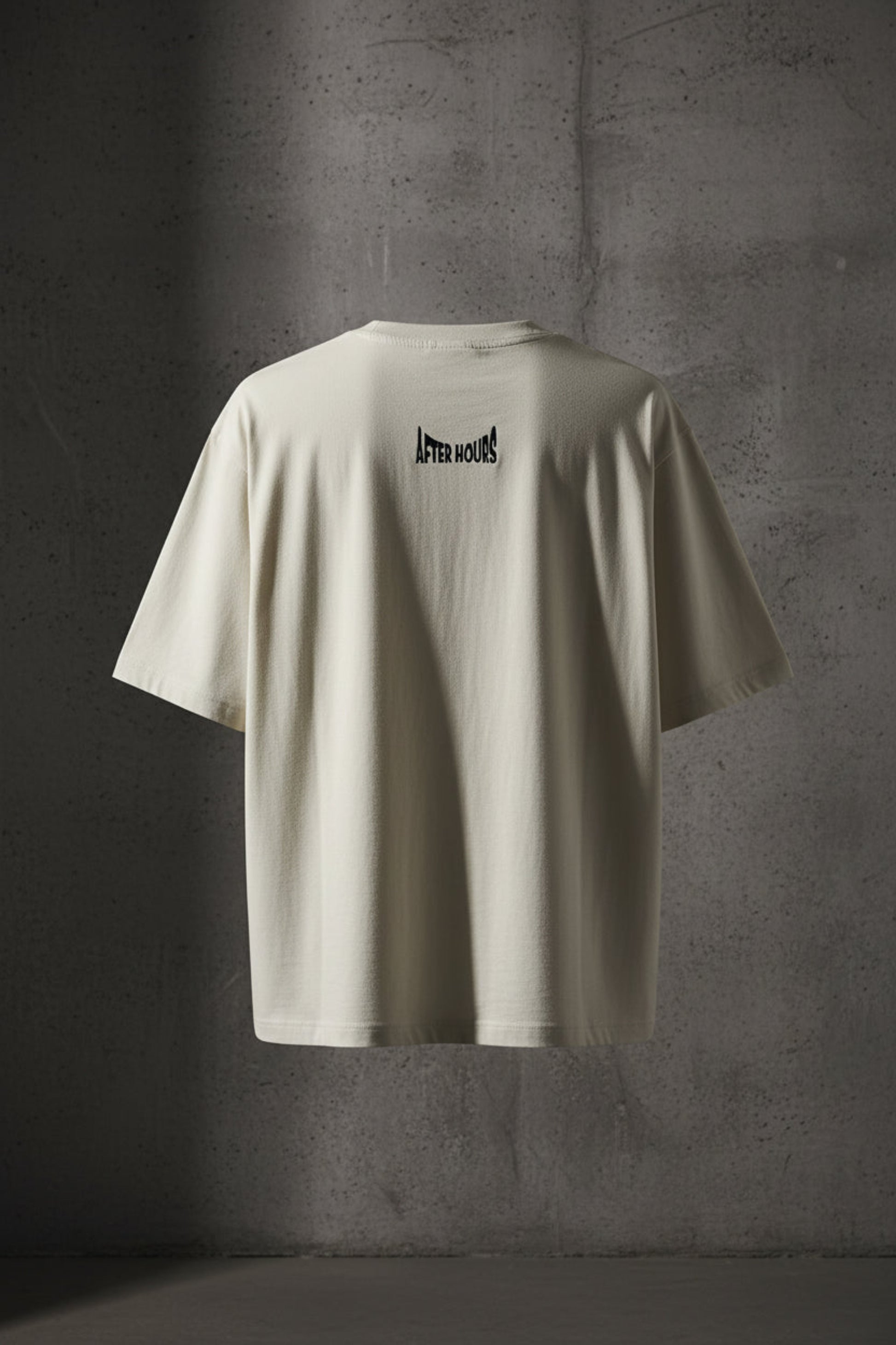 Off-white t-shirt with black text embroidered on the back against a grey background