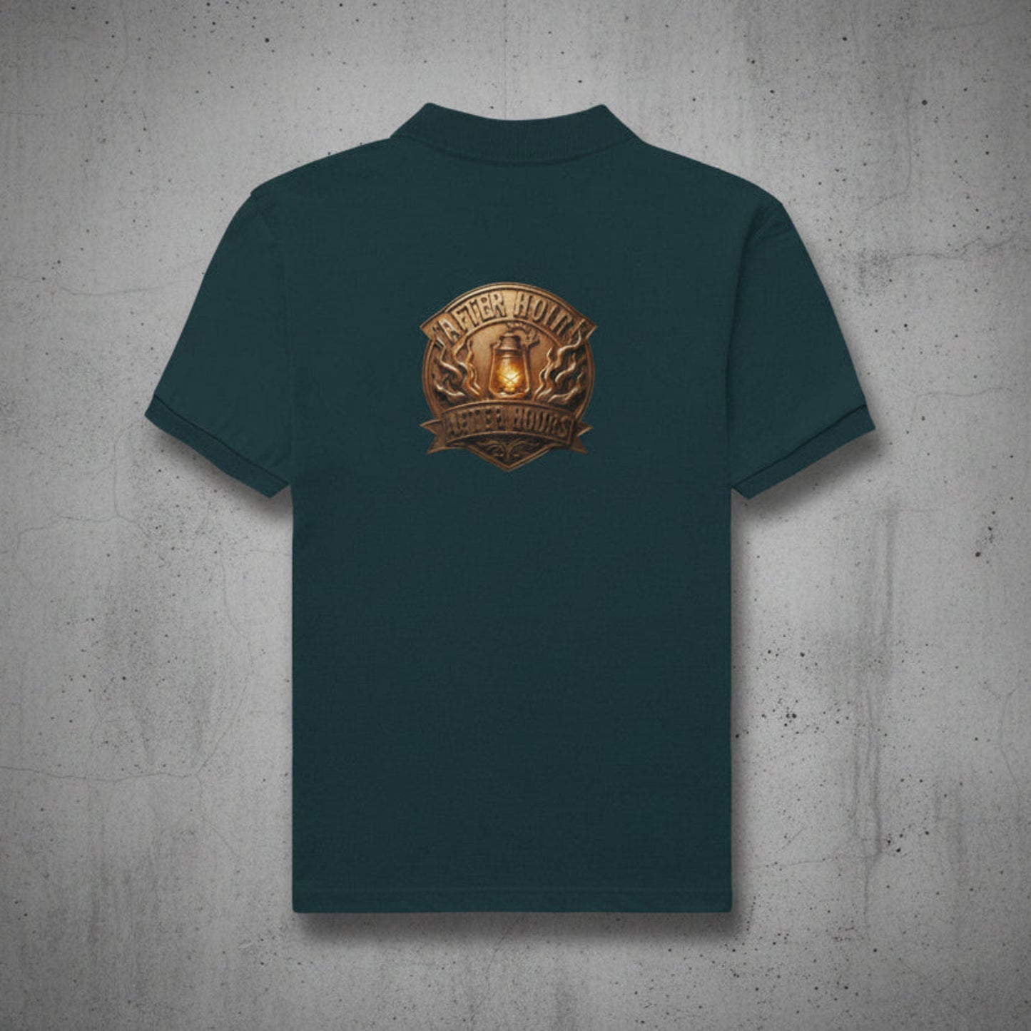 Petrol blue t-shirt with a gold and brown logo on the back against a grey textured wall background