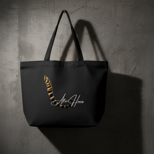 Black tote bag with a tiger stripe design and 'After Hours' text on a grey background
