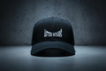 Black cap with 'After Hours' text embroidered on a grey background