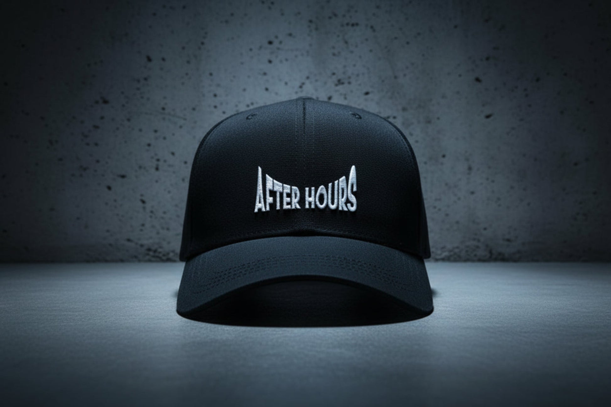 Black cap with 'After Hours' text embroidered on a grey background