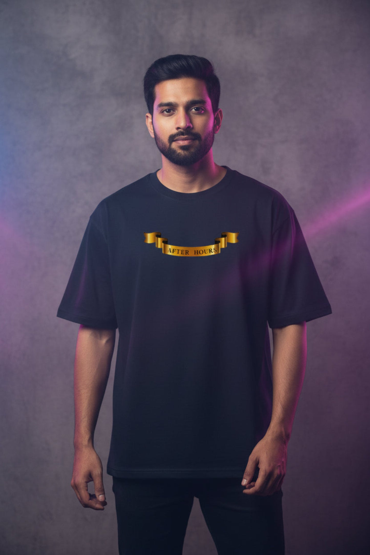 Black t-shirt with gold text on a grey background