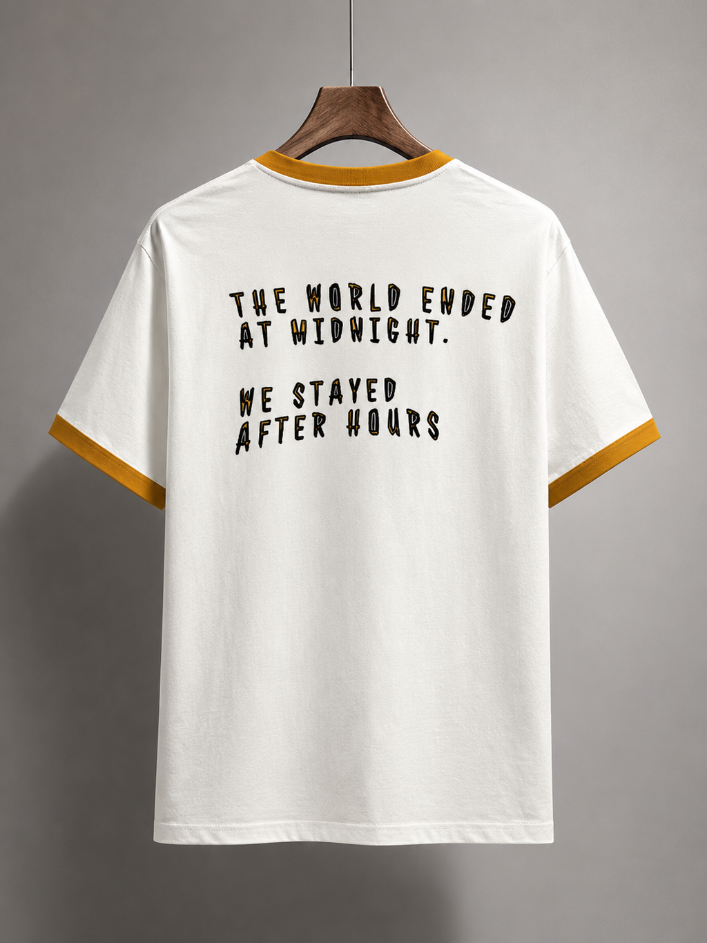 White t-shirt with black text on a gray background