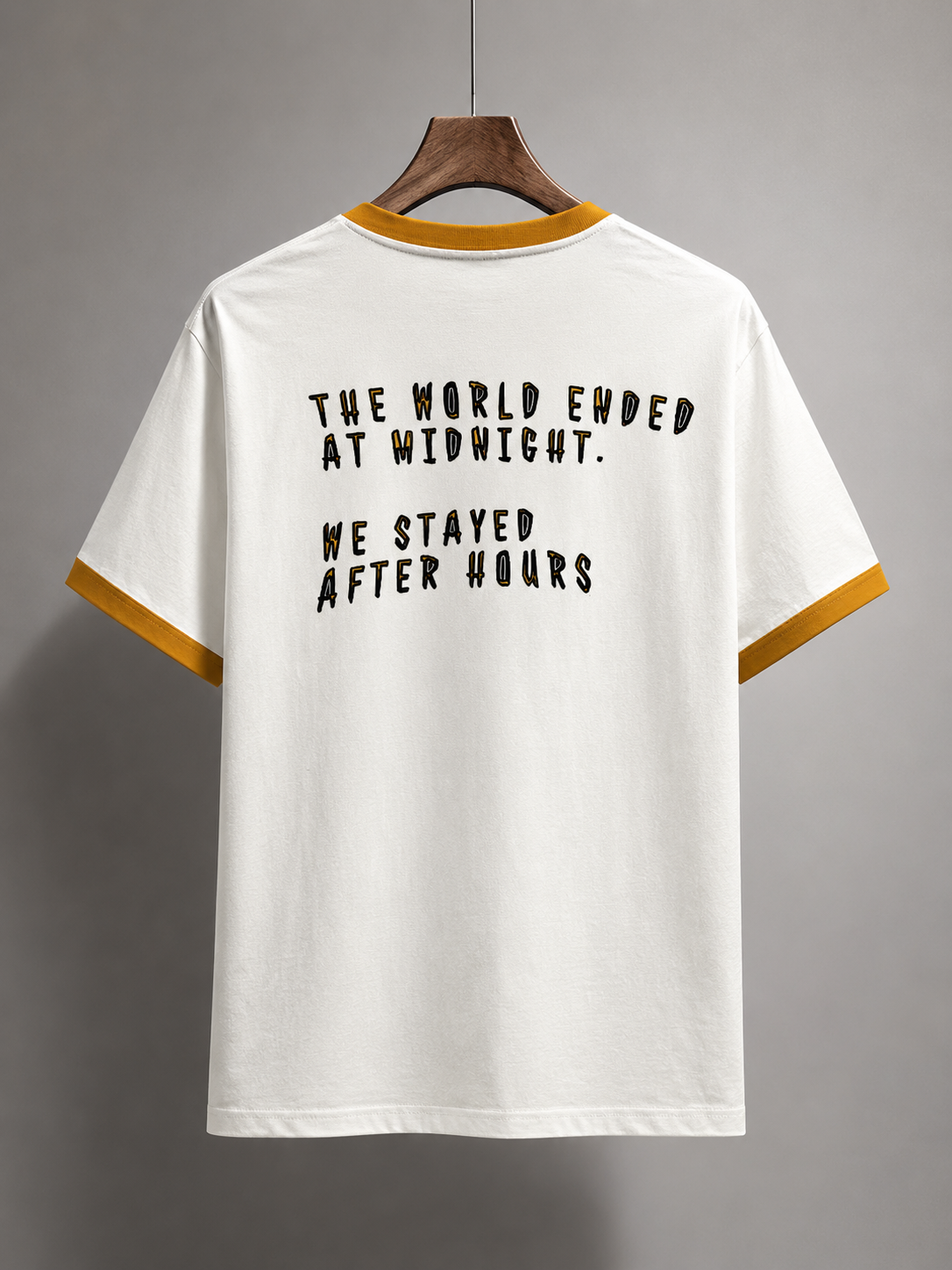 White t-shirt with black text on a gray background