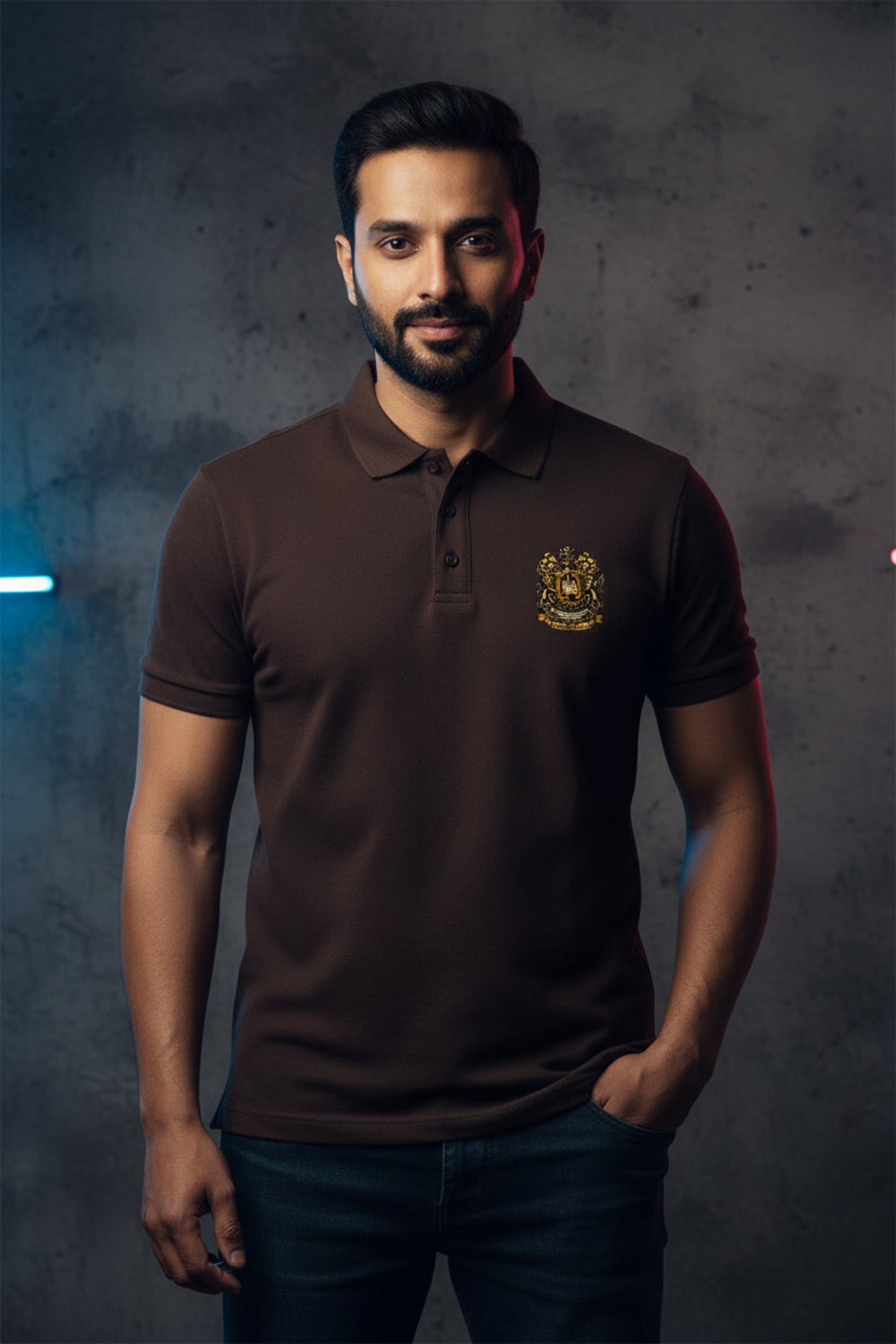 Brown polo shirt with the After Hours Coat of Arms emblem on a grey background