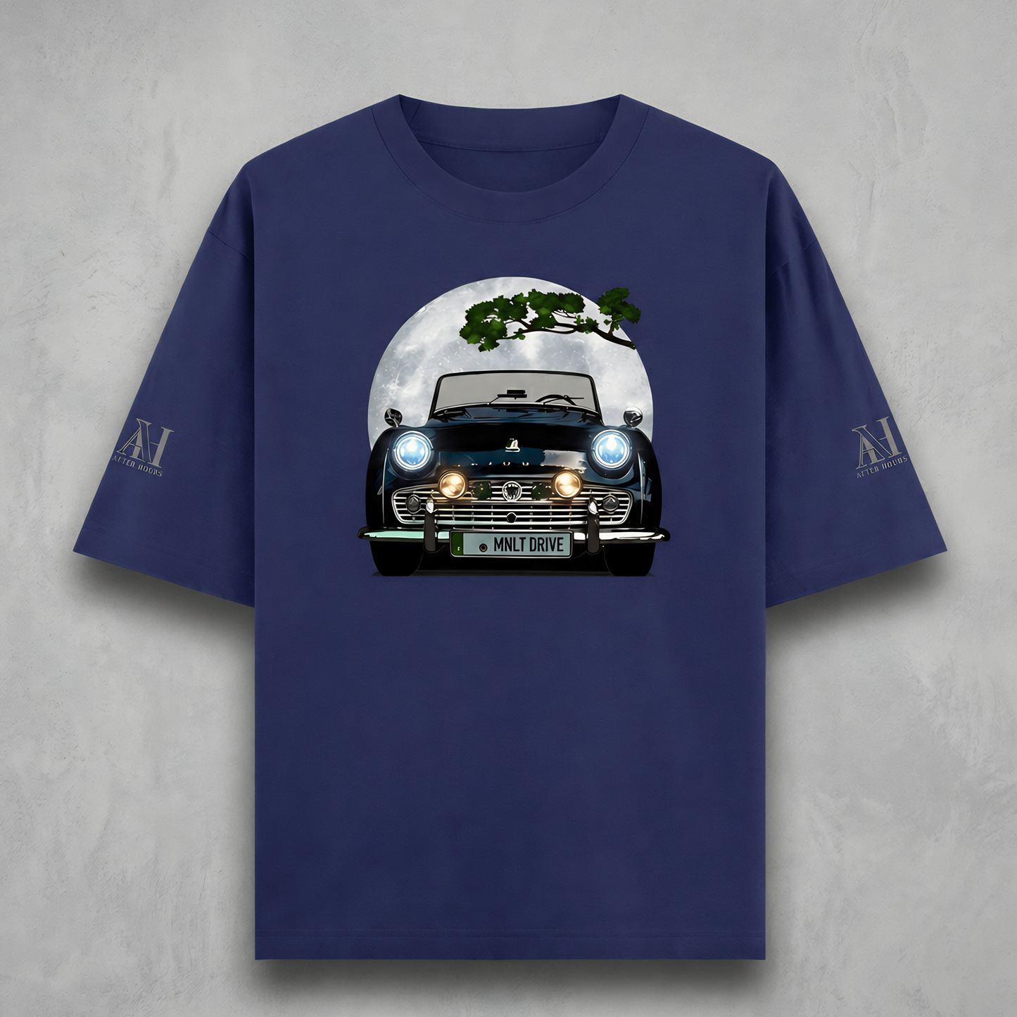 Navy blue t-shirt with a graphic of a car and tree on a gray background