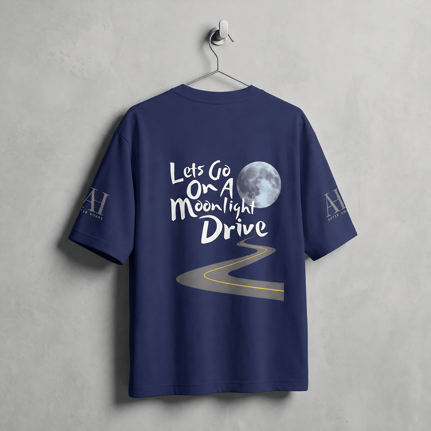 Navy blue t-shirt with 'Let's Go On A Moonlight Drive' text and moon graphic on a gray background