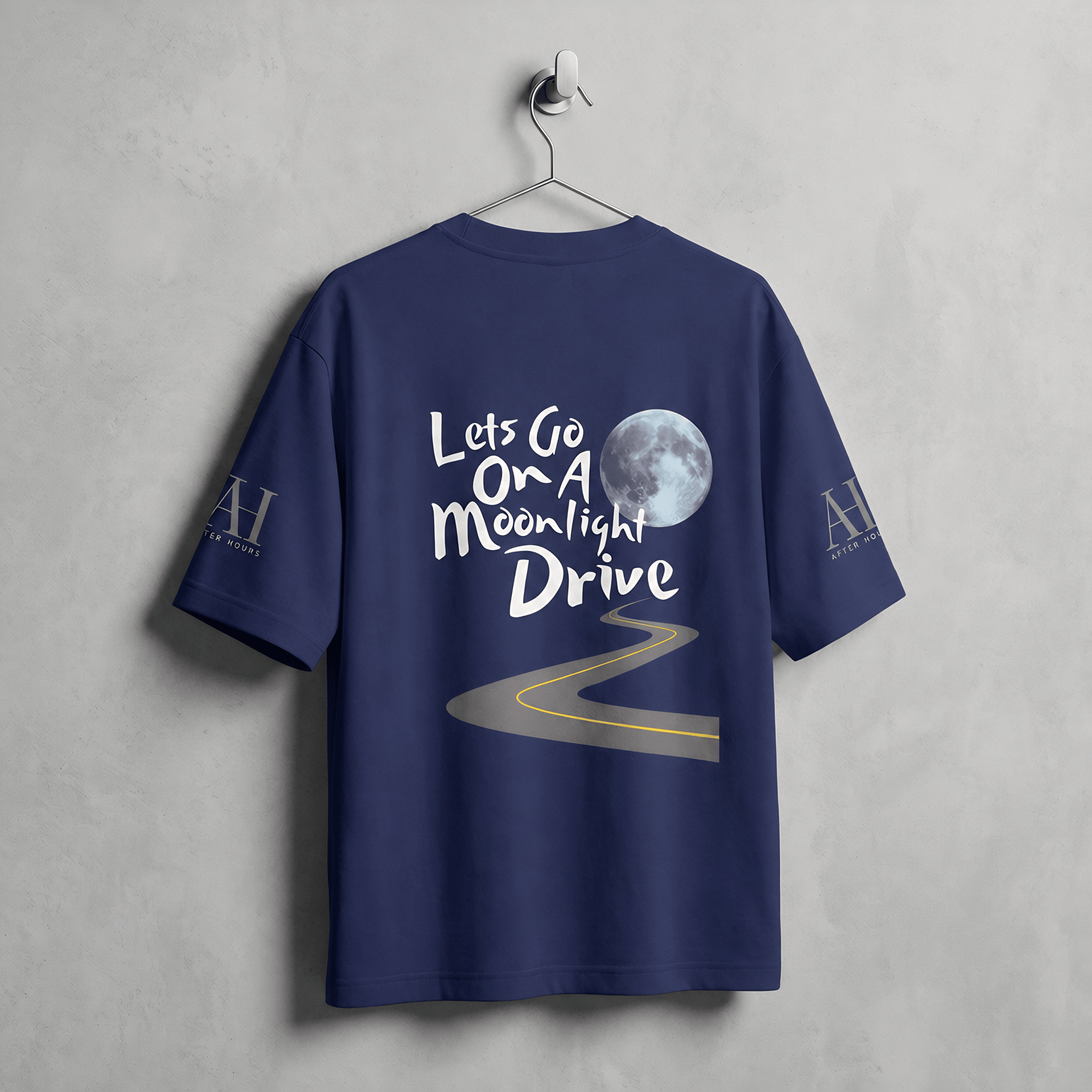 Navy blue t-shirt with 'Let's Go On A Moonlight Drive' text and moon graphic on a gray background