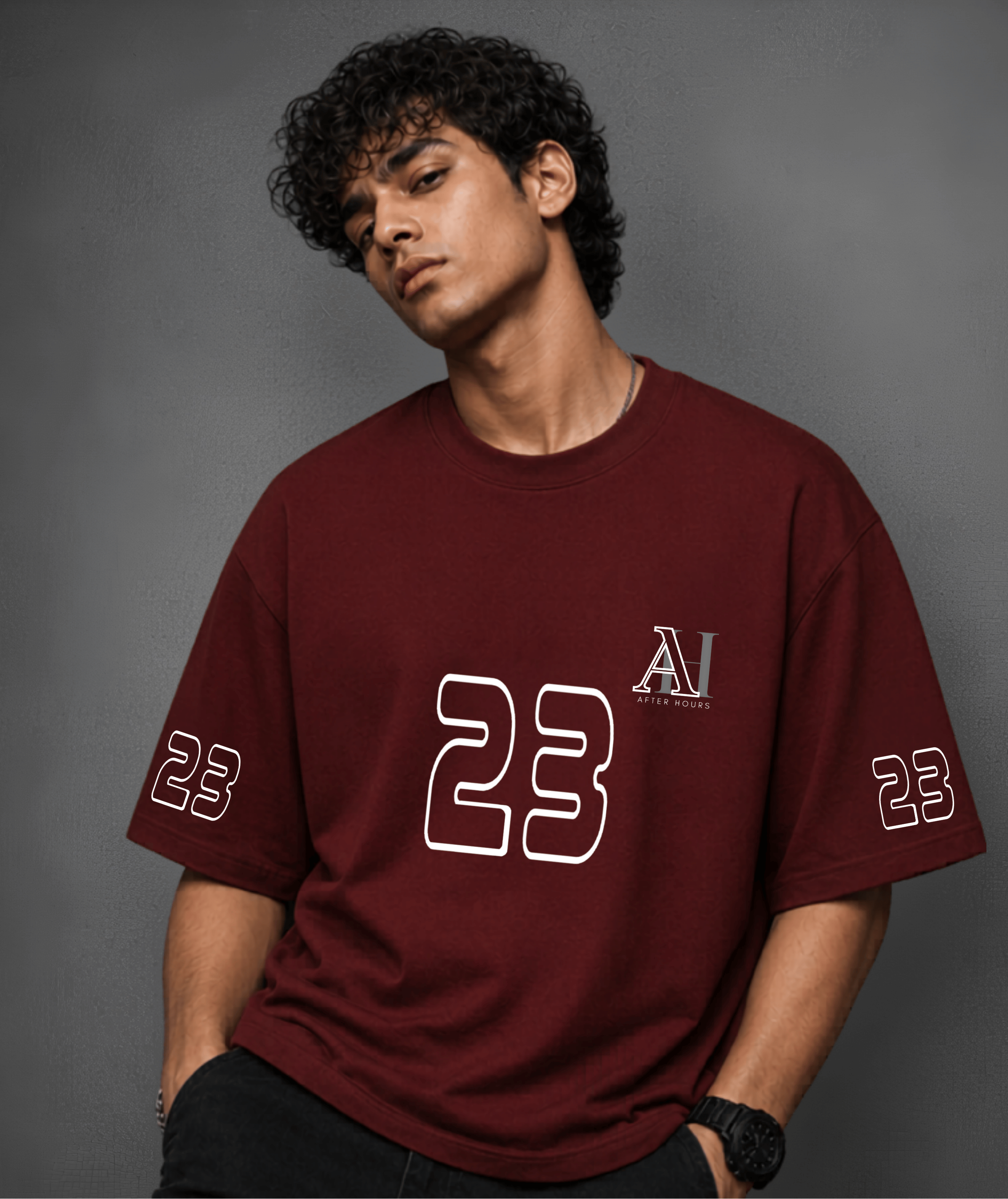 Person wearing a red t-shirt with '23' and logo on a grey background