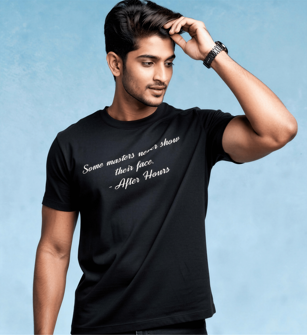 A man wearing a black short-sleeve t-shirt with white script text that reads 'Some masters never show their face. - After Hours', posed against a textured light blue background.