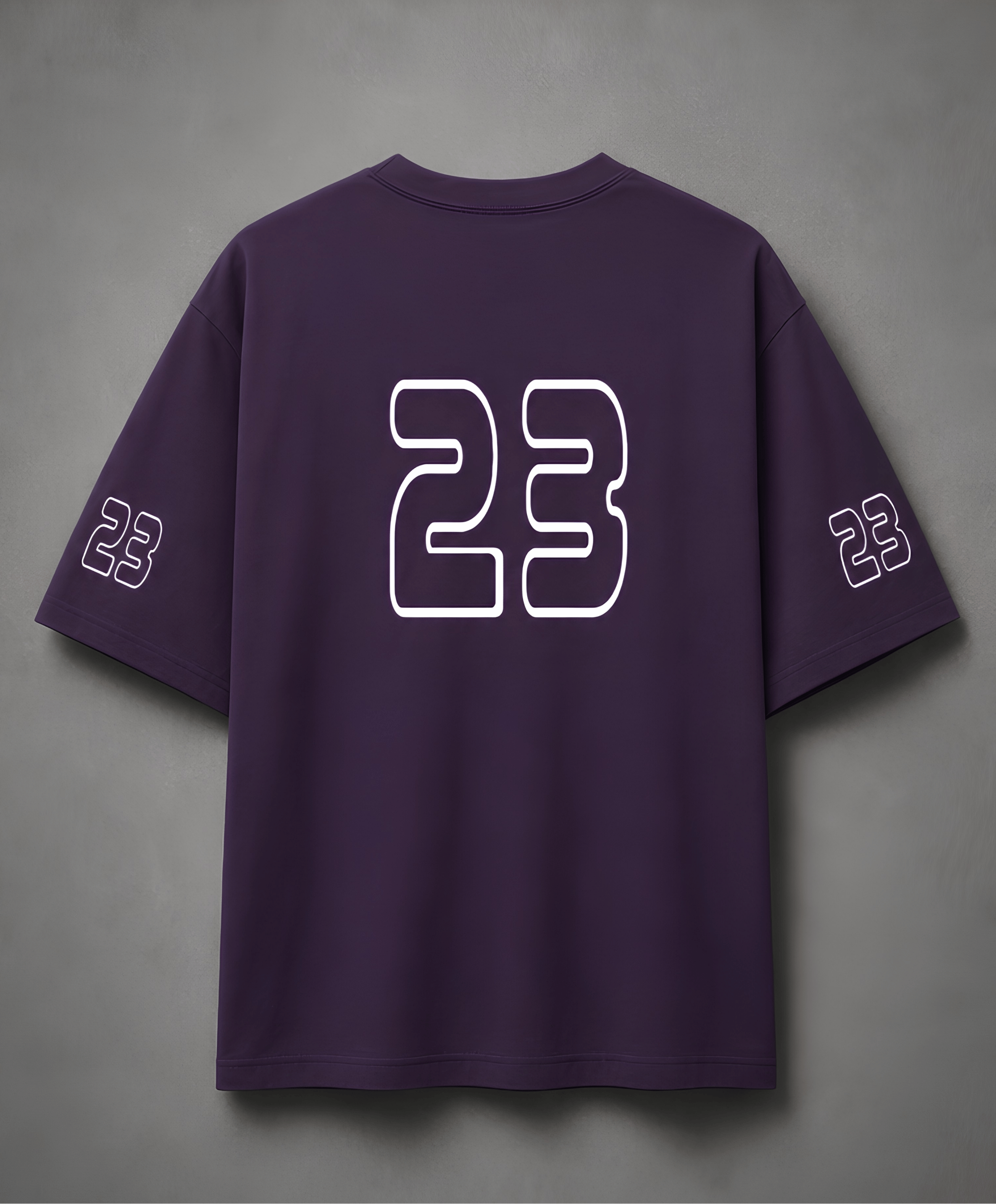 Purple t-shirt with number 23 on a grey background