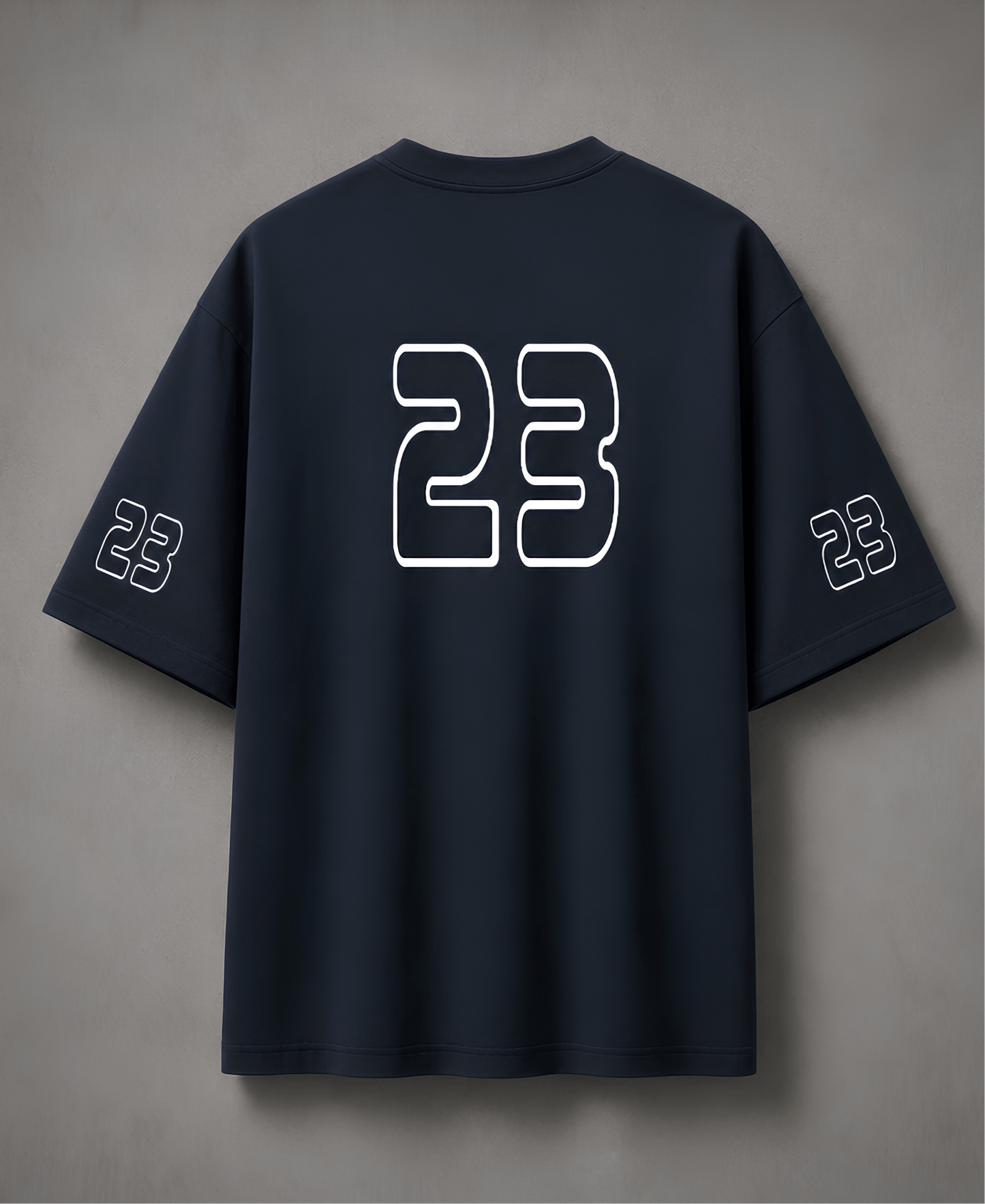 Navy blue t-shirt with number 23 on the back against a grey background