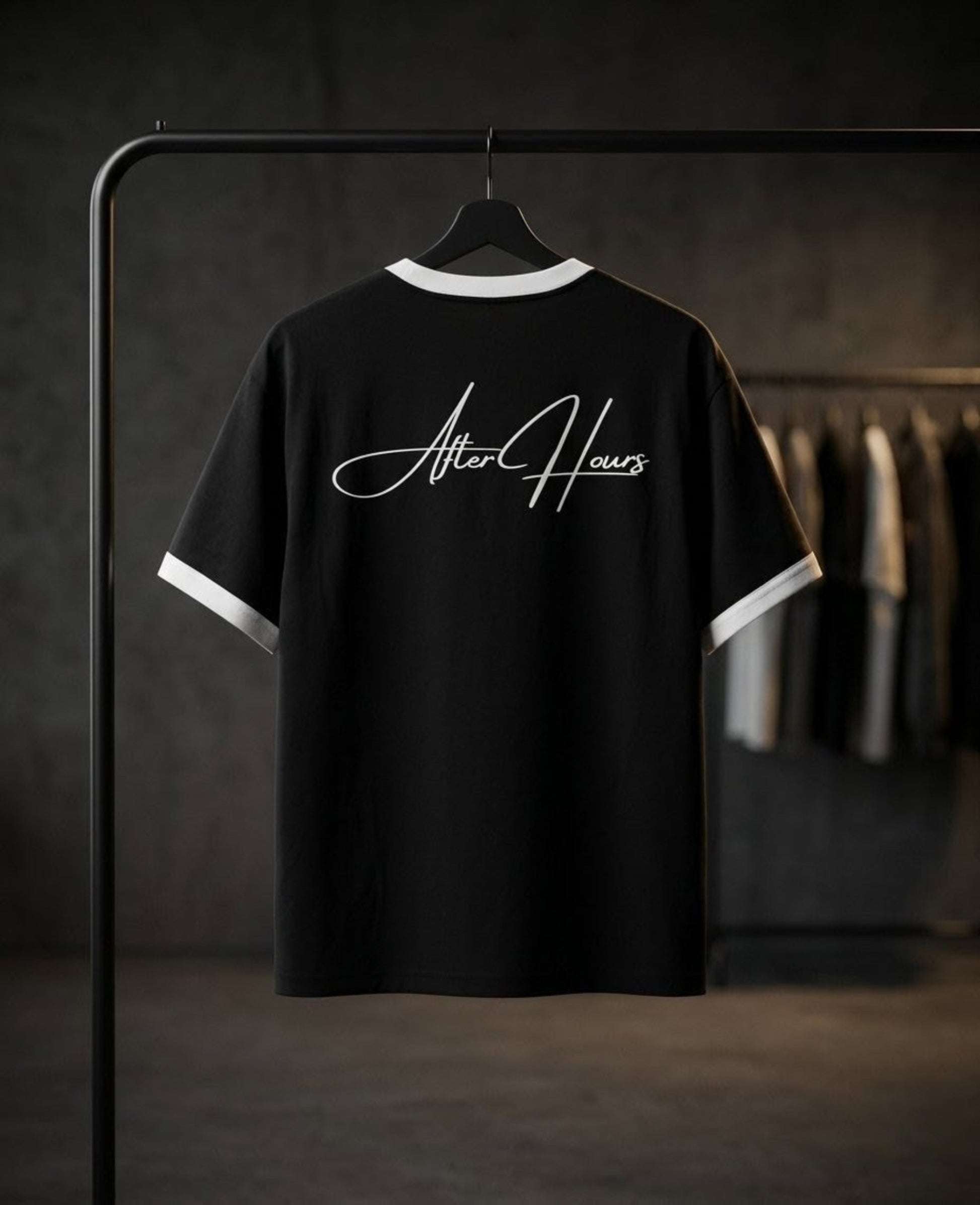 Black t-shirt with 'After Hours' text on a hanger against a dark background