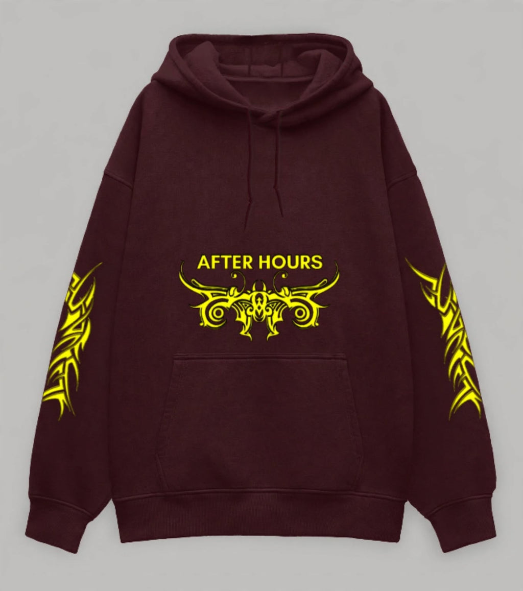 A dark maroon pullover hoodie with a yellow graphic print on the chest reading 'AFTER HOURS' and matching yellow tribal-style sleeve prints, shown against a neutral grey background.