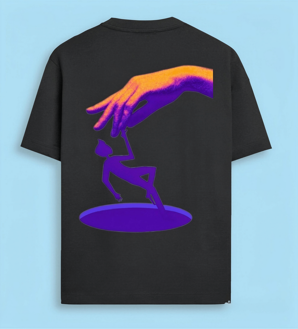 A black short-sleeve t-shirt with a colorful graphic print on the back, featuring a purple silhouette of a person reaching up to a large hand in orange and purple tones, set against a light blue background.