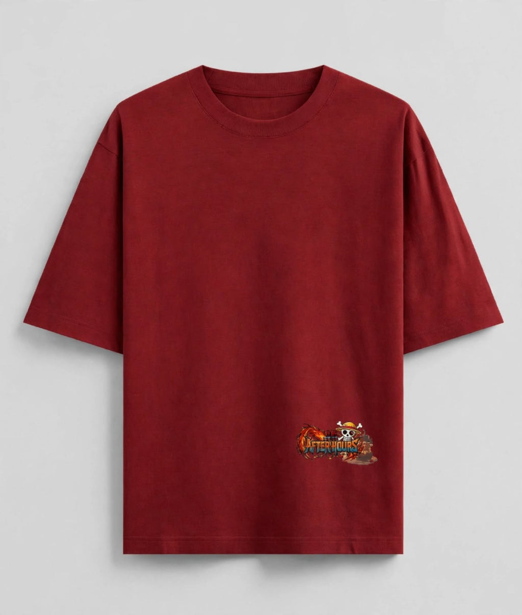 A dark red short-sleeve t-shirt with a small anime graphic on the lower left hem, displayed flat against a light grey background.
