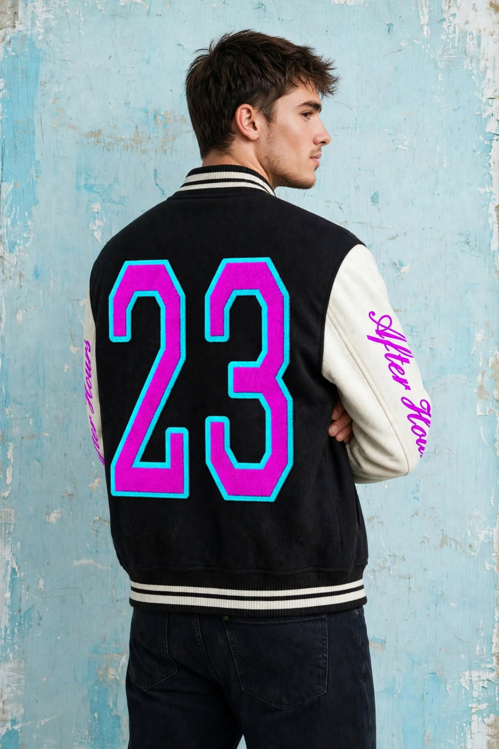 A man wearing a black and white varsity jacket, shown from the back. The jacket features a large neon pink and cyan number '23' on the back, with 'After Hours' written in pink script on the left sleeve.